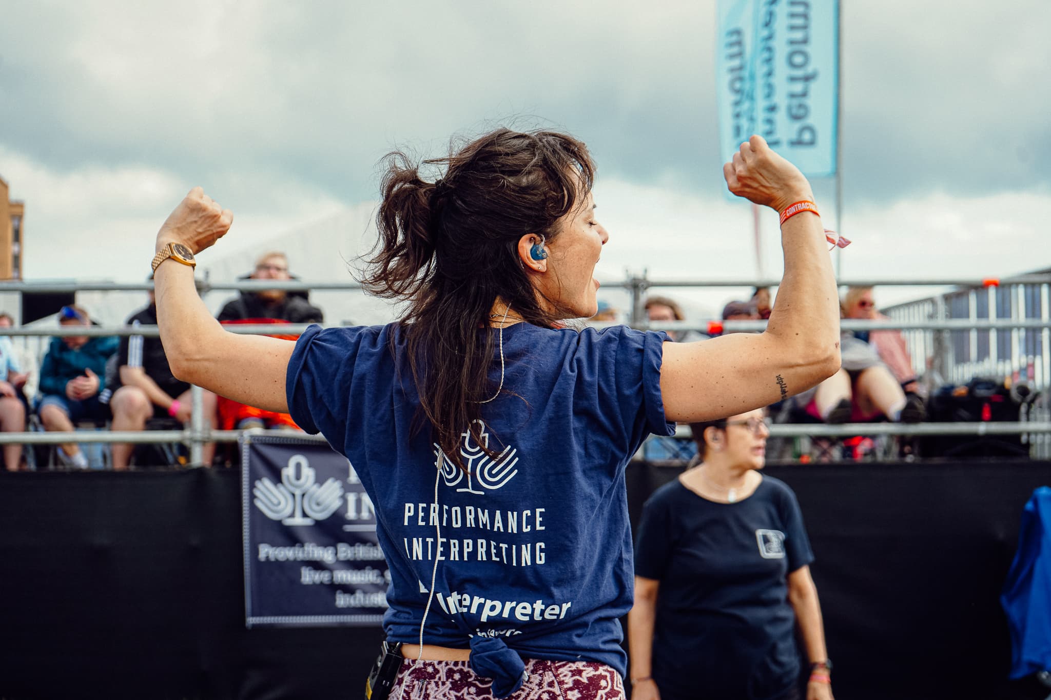 BSL-using festival-goers watching an interpreted set